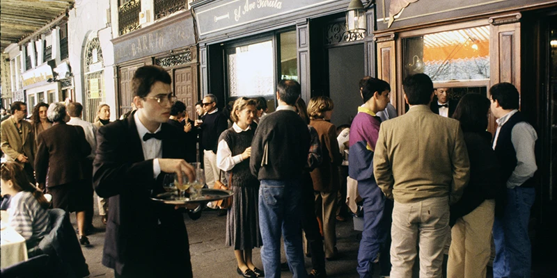 Evening atmosphere on Plaza Mayor with locals and visitors mixing at the cafe terraces